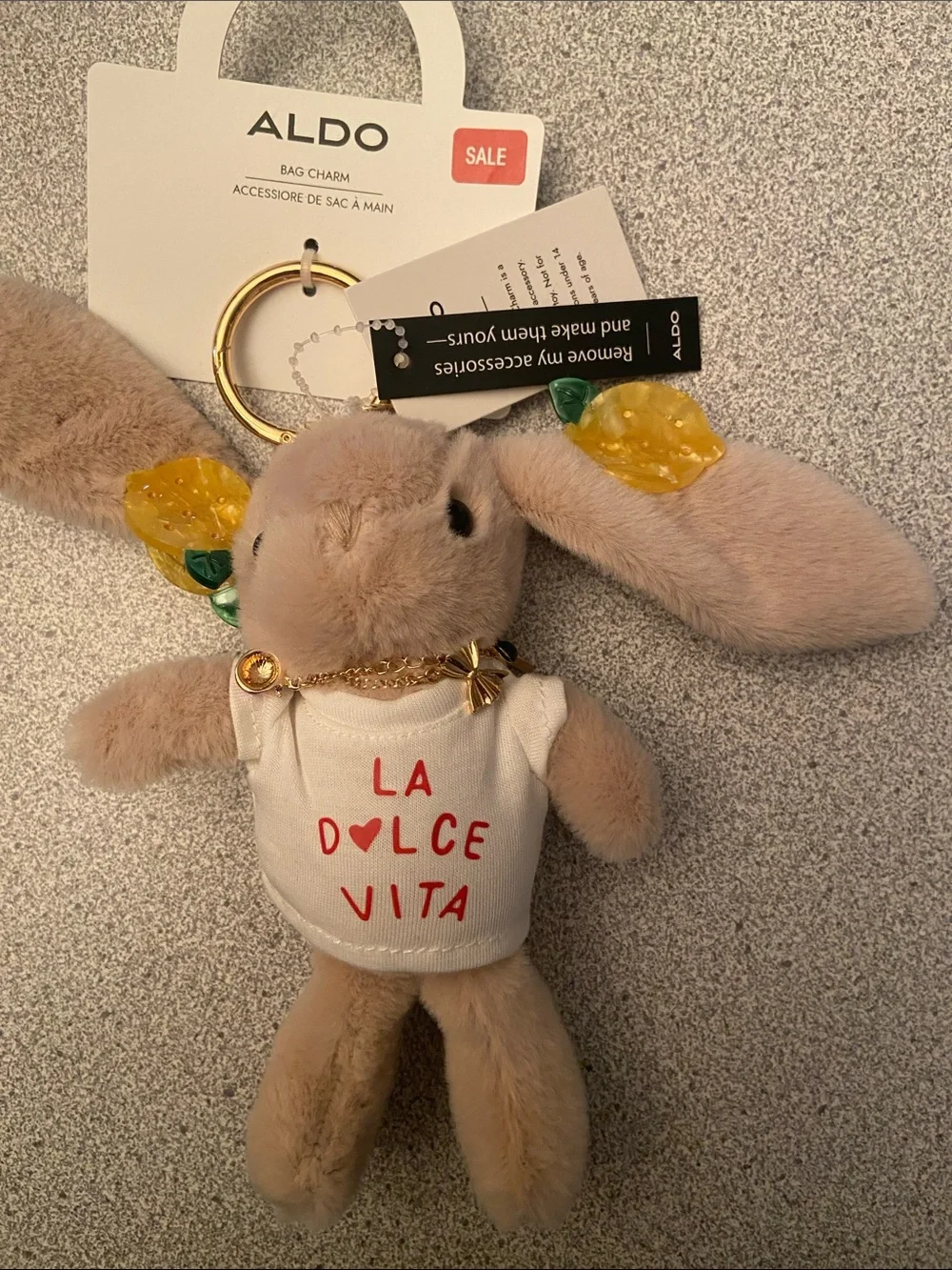 ALDO Beige Bunny Bag Charm with Yellow Leaf Accents